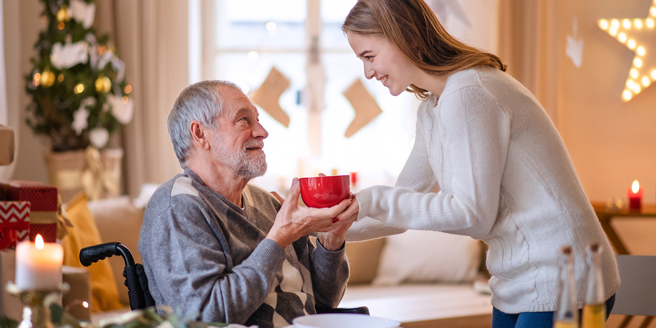 Girl helping an elderly man